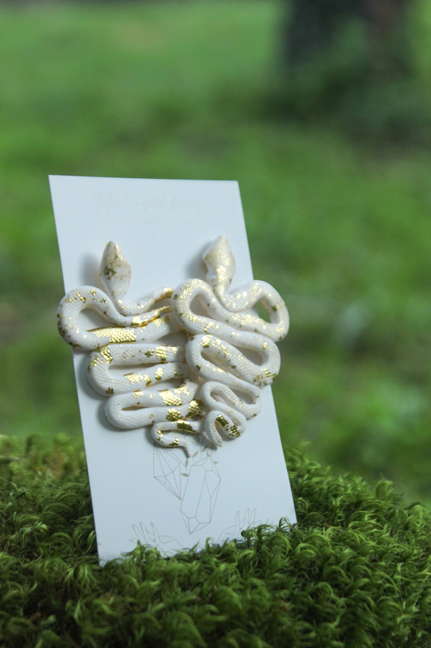 White Snakes with Gold Earrings